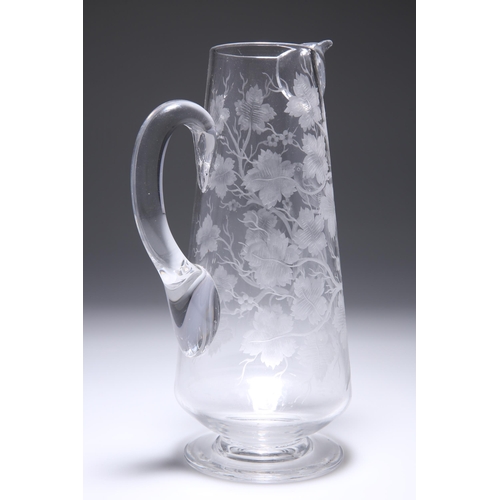 10 - A 19TH CENTURY GLASS JUG, PROBABLY STOURBRIDGE, cut with two birds amidst leafy branches. 25.5cm hig... 