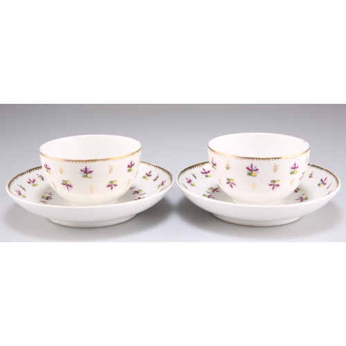 104 - A PAIR OF NYON TEA BOWLS AND SAUCERS, CIRCA 1790, each decorated with scattered flowers, each with u... 