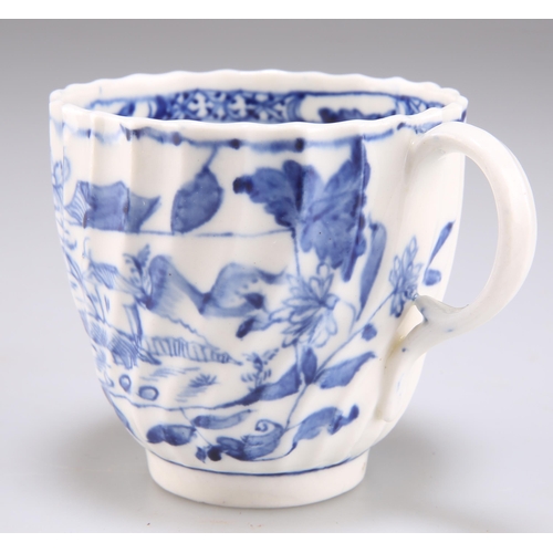 105 - A FACTORY X BLUE AND WHITE SPIRALLY FLUTED COFFEE CUP, CIRCA 1800, decorated with the 'Picture Postc... 