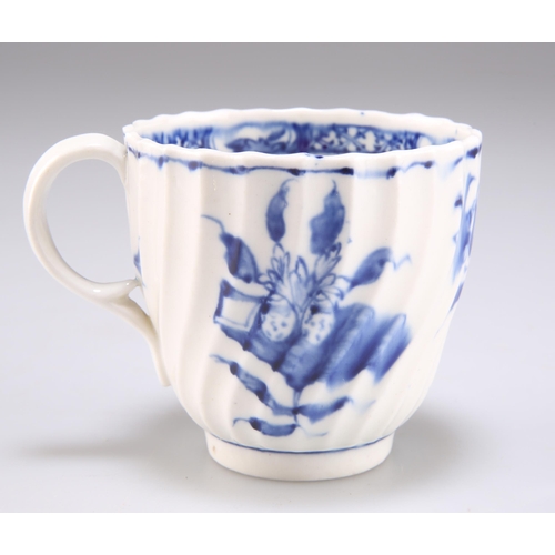 105 - A FACTORY X BLUE AND WHITE SPIRALLY FLUTED COFFEE CUP, CIRCA 1800, decorated with the 'Picture Postc... 