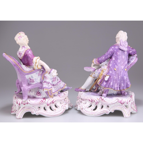 134 - A PAIR OF DRESDEN PORCELAIN FIGURES, modelled as a seated 18th Century lady and gentleman, on pierce... 