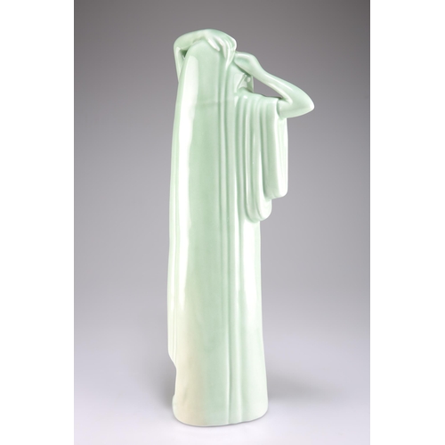 186 - AN ART DECO CELADON GLAZED FIGURE, modelled as a scantily clad maiden. 48cm high