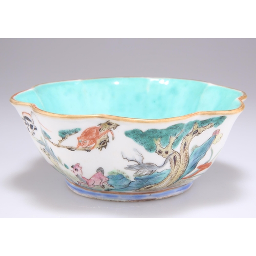 207 - A 19TH CENTURY CHINESE FAMILLE ROSE ZODIAC BOWL, of scalloped form, the exterior painted with the tw... 