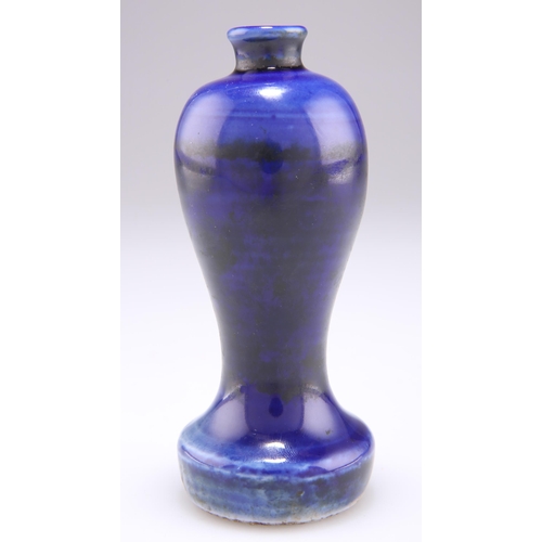 210 - A 19TH CENTURY COBALT BLUE GLAZED BOTTLE VASE, baluster form with a short cylindrical neck, on a tal... 