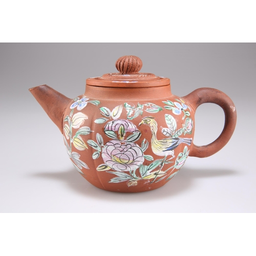 214 - A CHINESE YIXING TEAPOT, 19TH/20TH CENTURY, enamel painted with a bird and foliage. 18cm across hand... 