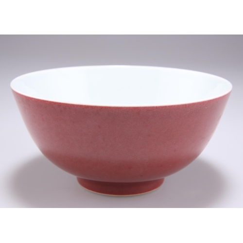 221 - A CHINESE RED-GLAZED BOWL, thinly potted, the exterior with a red glaze, the interior and base glaze... 