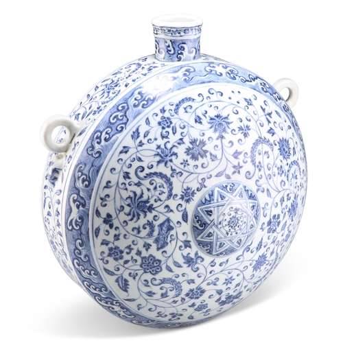 226 - A MING STYLE BLUE AND WHITE FLASK, BIANHU, circular form with a flat base and short cylindrical neck... 