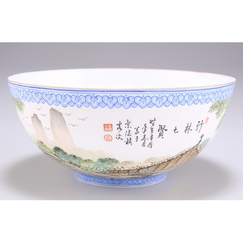 258 - A CHINESE EGGSHELL PORCELAIN BOWL, enamelled with figures in a fenced garden, bears an iron-red seal... 