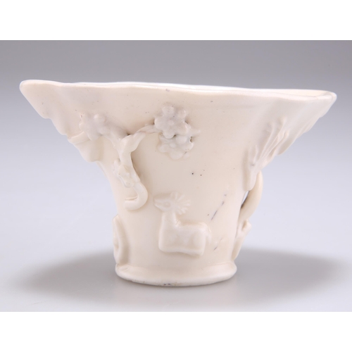 264 - A CHINESE BLANC DE CHINE LIBATION CUP, of a creamy colour. 10cm wide