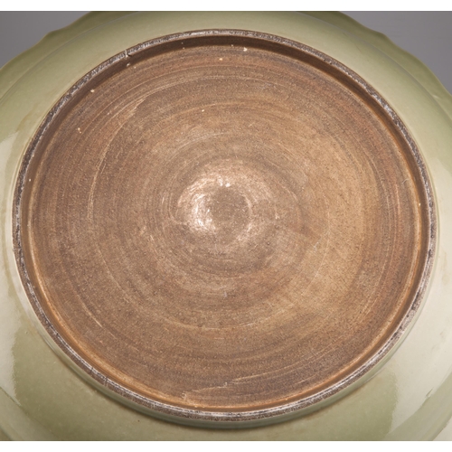 267 - A CHINESE LARGE CELADON DISH, the interior decorated with a large moulded lotus bloom, the everted r... 