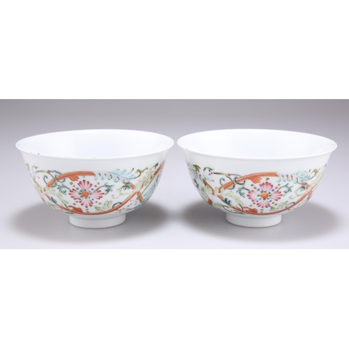 268 - A PAIR OF CHINESE FAMILLE ROSE BOWLS, circular, each painted with flowers and scrolling foliage, the... 