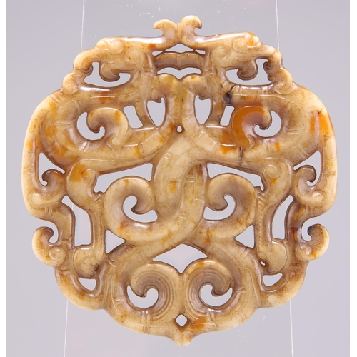 280 - A CHINESE JADE 'PHOENIX' PENDANT, POSSIBLY 18TH CENTURY, of scrolling openwork design. 6.5cm diamete... 