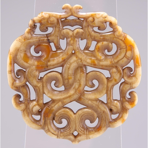 280 - A CHINESE JADE 'PHOENIX' PENDANT, POSSIBLY 18TH CENTURY, of scrolling openwork design. 6.5cm diamete... 