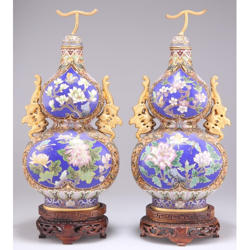 297 - A PAIR OF DOUBLE GOURD CLOISONNÉ VASES, with phoenix handles and 'stem' covers, decorated with reser... 