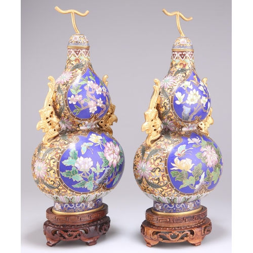 297 - A PAIR OF DOUBLE GOURD CLOISONNÉ VASES, with phoenix handles and 'stem' covers, decorated with reser... 