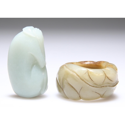 308 - A CARVED JADE THUMB RING, 2.5cm diameter; and A JADE CARVING OF A MONKEY, 5.2cm by 3cm. (2)