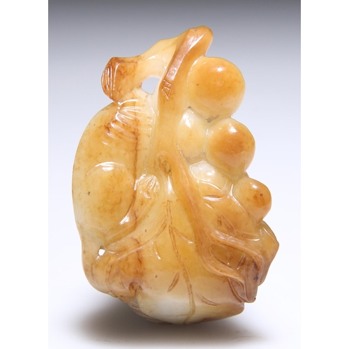 320 - A JADE CARVING OF A SQUIRREL AND GRAPES. 7cm by 4.5cm