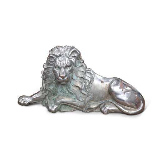 346 - A LARGE CHROMED CAST IRON LION, cast recumbent. 69cm wide