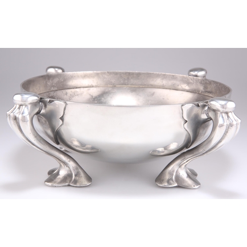 370 - OLIVER BAKER FOR LIBERTY & CO, A LARGE TUDRIC PEWTER BOWL, NO.067, squat form and raised on four lea... 