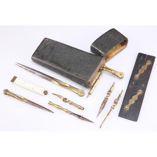 390 - A GEORGE III DRAWING SET SHAGREEN ETUI, with brass and steel instruments. Case 17.5cm high