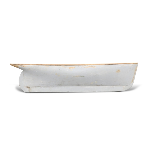 392 - A VICTORIAN WOODEN POND YACHT HULL, the model boat painted grey. 166.5cm long