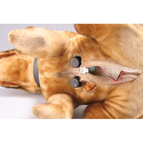 404 - A VINTAGE JAPANESE SOFT TOY RADIO, in the form of a sitting dog, with a zip to underside opening to ... 