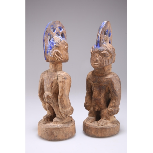 430 - A PAIR OF NIGERIAN YORUBA 'ERE IBEJI' TWIN MALE CARVED WOODEN FIGURES, EARLY 20TH CENTURY, the West ... 