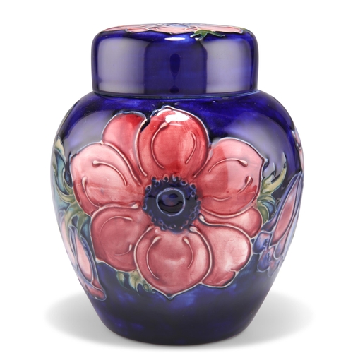 45 - A WALTER MOORCROFT POTTERY GINGER JAR AND COVER, 'Anemone' pattern, tubelined and hand-painted in to... 