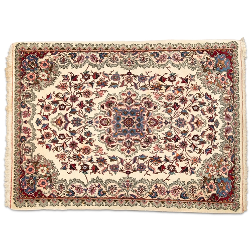 458 - A NORTH PERSIAN RUG, hand-knotted, the cream field with scrolling foliate design in dark red, blue a... 