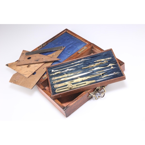 476 - A ROSEWOOD CASED SET OF BRASS-MOUNTED DRAWING INSTRUMENTS, the blue velvet fitted tray containing tw... 