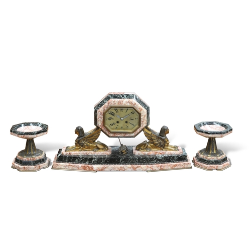 487 - A FINE ART DECO MARBLE CLOCK GARNITURE, the octagonal case raised on a pair of bronze sphinxes, all ... 