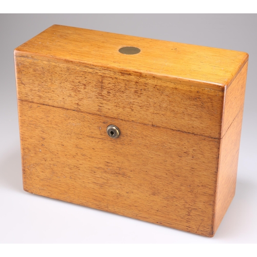 510 - A VICTORIAN OAK DECANTER CASE, the rectangular box with hinged cover and Bramah lock, containing thr... 