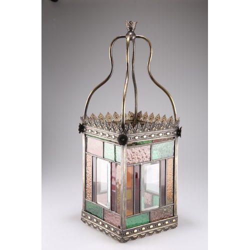 522 - A VICTORIAN BRASS, LEADED AND STAINED GLASS LANTERN, applied to each corner with a flower head below... 