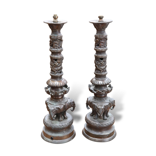 523 - A LARGE PAIR OF JAPANESE BRONZE LAMP BASES, CIRCA 1900, each cast with elephants. (2) Tallest 48.5cm... 