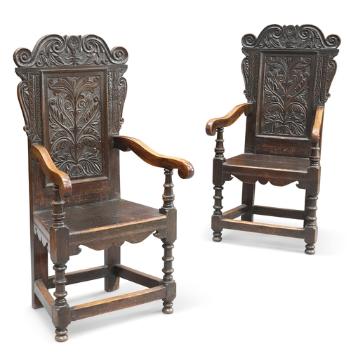 544 - A PAIR OF 17TH CENTURY STYLE OAK WAINSCOT CHAIRS, 19TH CENTURY, each with scroll and foliate-form cr... 