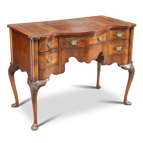 549 - A QUEEN ANNE STYLE WALNUT SERPENTINE DESK, the top with gilt-tooled leather three-piece writing surf... 