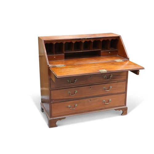 573 - A GEORGE III MAHOGANY SLANT-FRONT BUREAU, the slope opening to reveal a pair of drawers and pigeon h... 