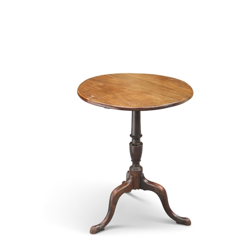 575 - A GEORGE III MAHOGANY TRIPOD TABLE, the circular tilt-top raised on a vasi-form stem continuing to h... 