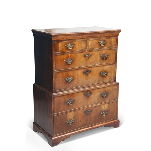 585 - AN EARLY 18TH CENTURY SMALL WALNUT CHEST ON CHEST, EAST YORKSHIRE, the upper section with two short ... 