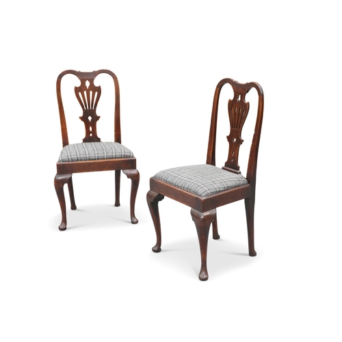 586 - A PAIR OF EARLY 18TH CENTURY WALNUT AND ELM SIDE CHAIRS, each with pierced splat above a drop-in sea... 