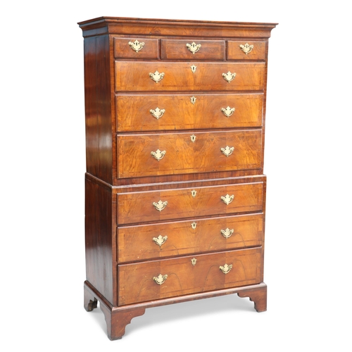 589 - AN 18TH CENTURY WALNUT AND HERRINGBONE CHEST ON CHEST, with cavetto cornice above three short over t... 