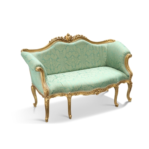 594 - AN 18TH CENTURY STYLE GILDED AND UPHOLSTERED SETTEE, the crest rail moulded and pierced with foliage... 