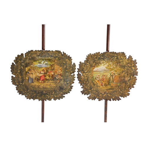 596 - A PAIR OF REGENCY BRASS-MOUNTED ROSEWOOD POLE SCREENS, each banner painted with figures within an oa... 