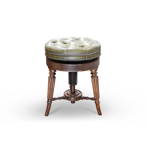 599 - A FINE REGENCY ROSEWOOD PIANO STOOL, the circular deep-buttoned leather adjustable seat above a reed... 