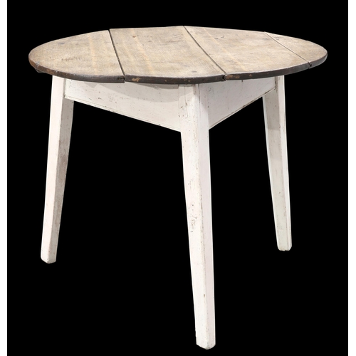 609 - AN EARLY 19TH CENTURY OAK CRICKET TABLE, the circular top raised on a painted base with three splaye... 