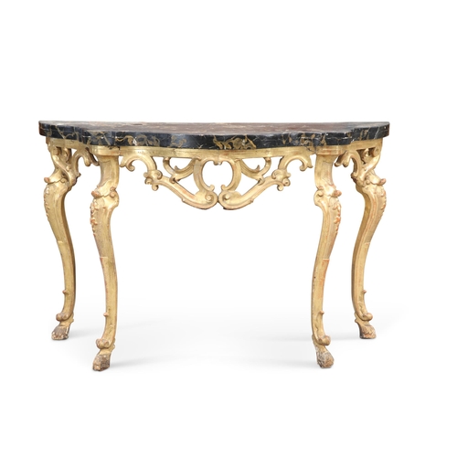 616 - A 19TH CENTURY GILTWOOD AND FAUX MARBLE CONSOLE TABLE, the shaped painted top above a pierced scroll... 