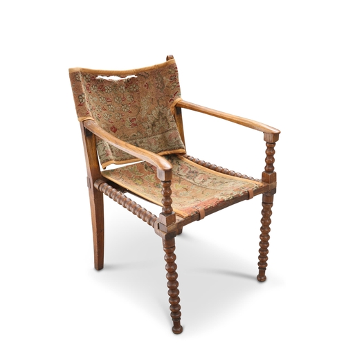 620 - A 19TH CENTURY OAK BOBBIN-TURNED CAMPAIGN CHAIR, with slung back and seat. Height of back 76.5cm