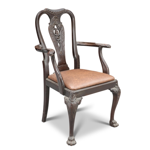 622 - A 19TH CENTURY PADAUK OPEN-ARMCHAIR, the waisted padouk back carved with bellflowers, C-scrolls and ... 