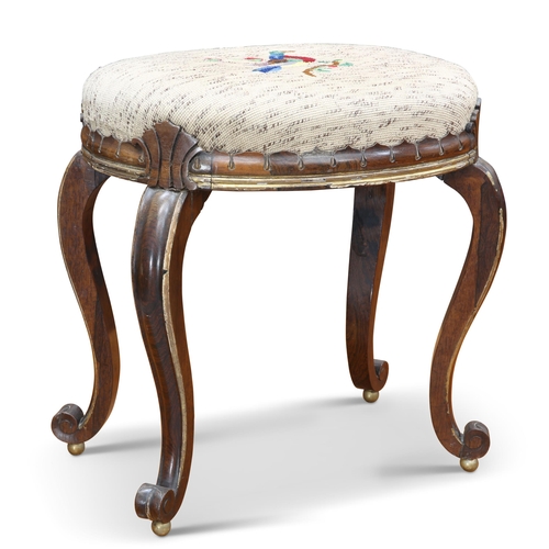 623 - A 19TH CENTURY PARCEL-GILT ROSEWOOD STOOL, the upholstered oval seat raised on S-scroll legs termina... 