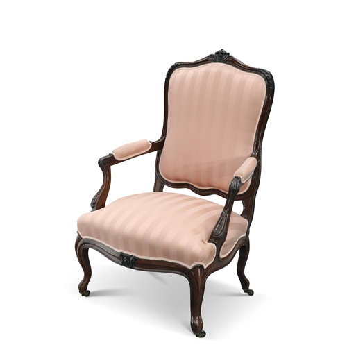 624 - A 19TH CENTURY ROSEWOOD OPEN ARMCHAIR, IN LOUIS XV STYLE, of large proportions, the cartouche-shaped... 